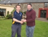 Michael Magill receives trophy for longest drive from Club Chairman Michael Hardy