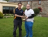 Michael O’Neill receives trophy for nearest the pin from Club Chairman Michael Hardy